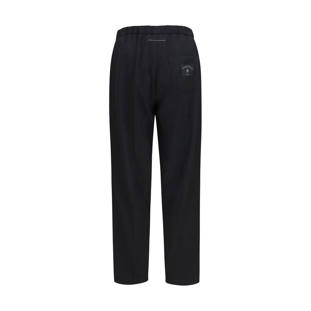 Black MM6 polyester casual pants with a relaxed fit and minimal design, suitable for everyday wear.