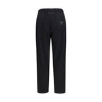 Black MM6 polyester casual pants with a relaxed fit and minimal design, suitable for everyday wear.