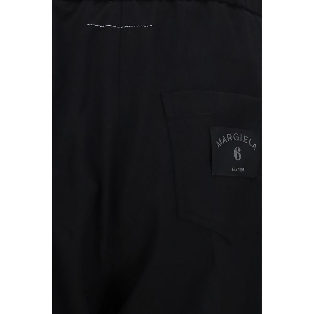 Black polyester casual pants by MM6, featuring a relaxed fit and minimalist design, displayed on a neutral background.