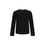 Black wool MM6 Aries sweatshirt with oversized fit and subtle branding, shown on a hanger against a plain background.