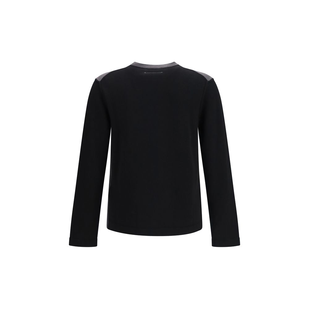 Black wool MM6 Aries sweatshirt with oversized fit and subtle branding, shown on a hanger against a plain background.