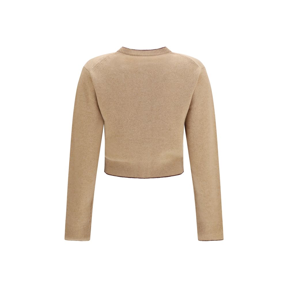 Chloé beige wool Oves Aries cardigan with button details and ribbed cuffs, displayed on a neutral background.