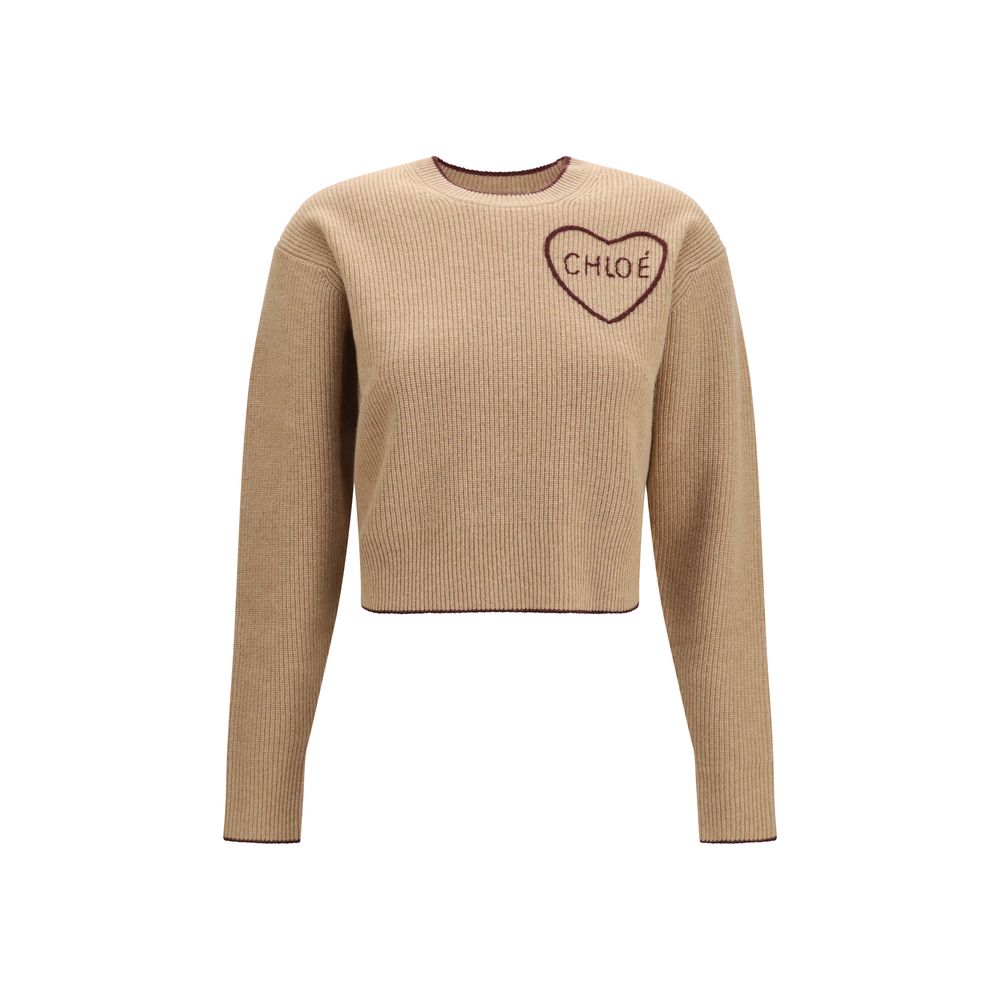 Chloé beige wool Oves Aries sweatshirt with a relaxed fit and ribbed cuffs, displayed on a hanger.