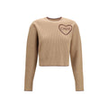Chloé beige wool Oves Aries sweatshirt with a relaxed fit and ribbed cuffs, displayed on a hanger.