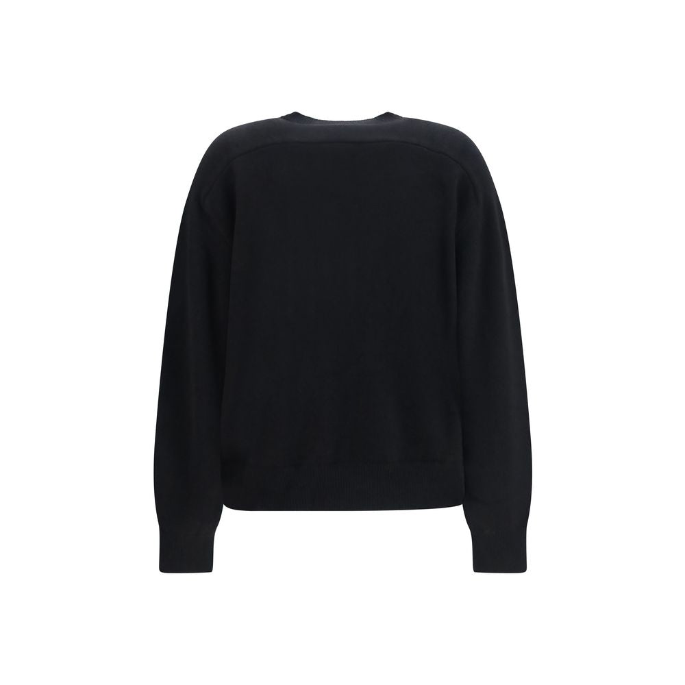 Black cashmere sweatshirt by Loulou De Saison displayed on a hanger, showcasing soft, luxurious fabric and casual style.