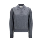 Gray cashmere shirt from Loulou De Saison, featuring a soft, cozy fabric and classic design, shown on a model.