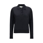Black cashmere dress shirt by Loulou De Saison, featuring a classic collar and button-front design, displayed on a hanger.