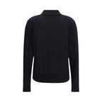 Loulou De Saison black cashmere dress shirt displayed on a hanger, showcasing its soft fabric and tailored fit.