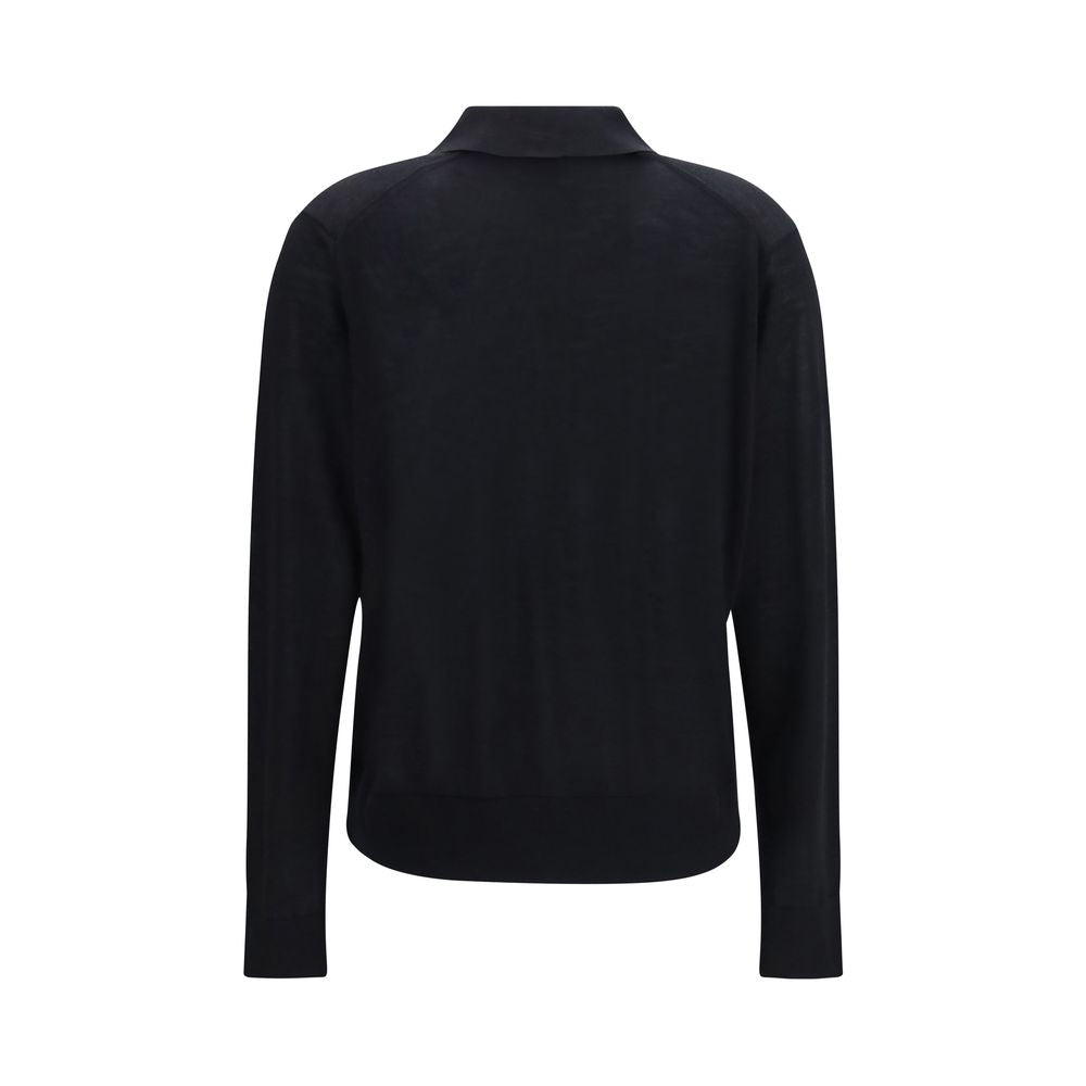 Loulou De Saison black cashmere dress shirt displayed on a hanger, showcasing its soft fabric and tailored fit.