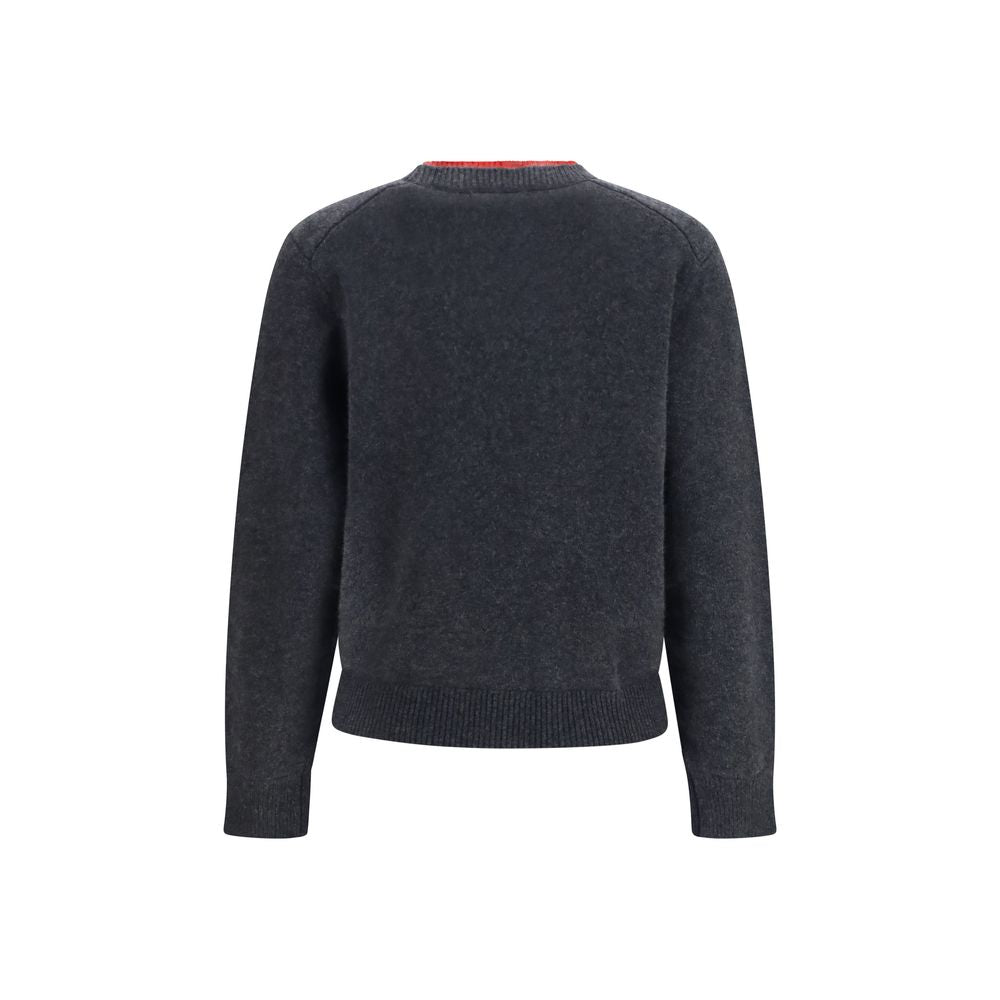Gray cashmere sweater by Loulou De Saison, soft knit with a relaxed fit and ribbed cuffs, displayed on a neutral background.