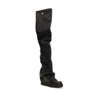 Black polyurethane over-the-knee boots by The Attico, featuring a sleek design and high shaft length.