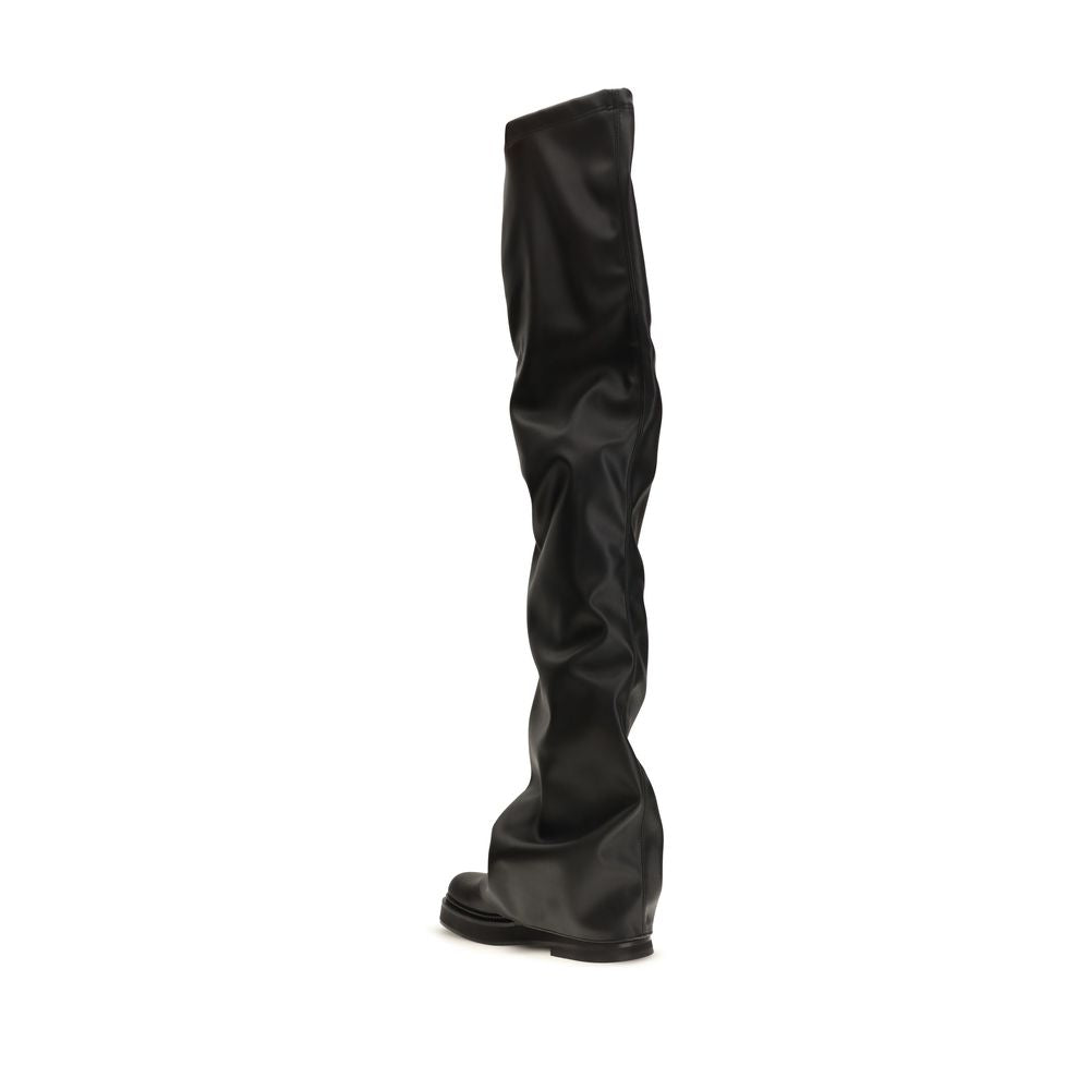 Black polyurethane over-the-knee boots by The Attico, featuring a sleek, fitted design and pointed toe on a clean background.