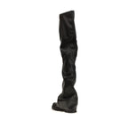 Black polyurethane over-the-knee boots by The Attico, featuring a sleek, fitted design and pointed toe on a clean background.