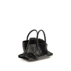 Black calf leather Bos Taurus handbag by The Attico featuring sleek design and gold-tone hardware.