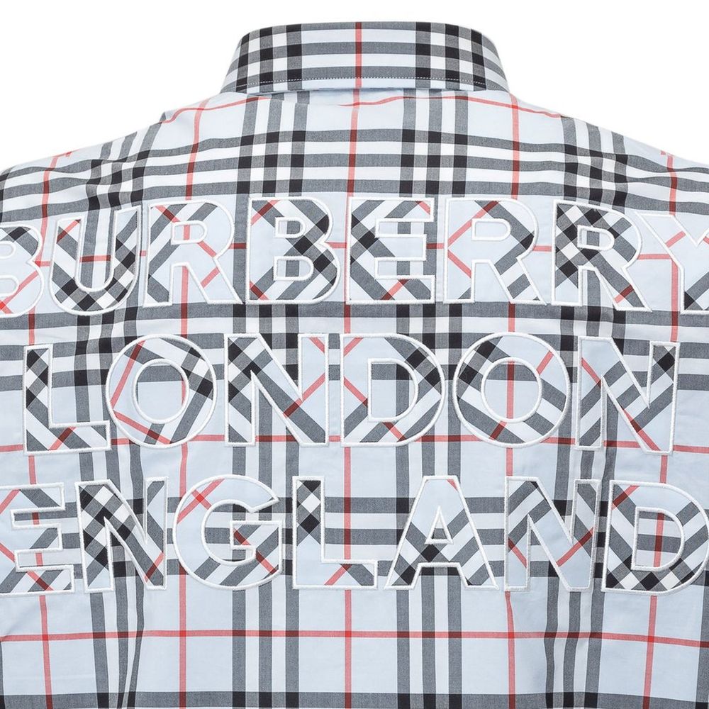 Burberry blue cotton shirt with a distinctive pattern, featuring classic collar and button-front design.