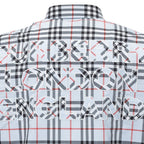 Burberry blue cotton shirt with a distinctive pattern, featuring classic collar and button-front design.