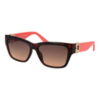 Guess brown plastic sunglasses with rounded frames, stylish design, and dark lenses for sun protection.