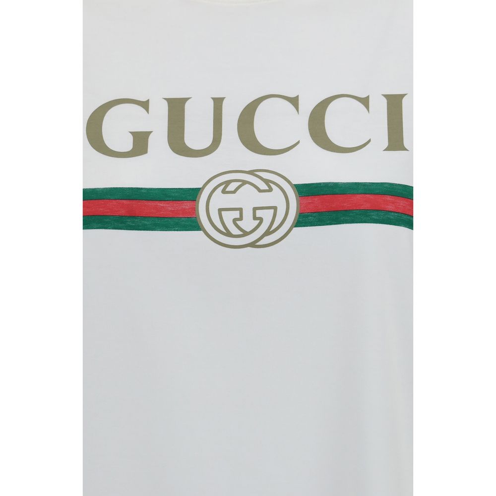 White cotton Gucci T-shirt with round neckline and short sleeves, featuring subtle branding, laid flat on a white background.