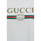 White cotton Gucci T-shirt with round neckline and short sleeves, featuring subtle branding, laid flat on a white background.