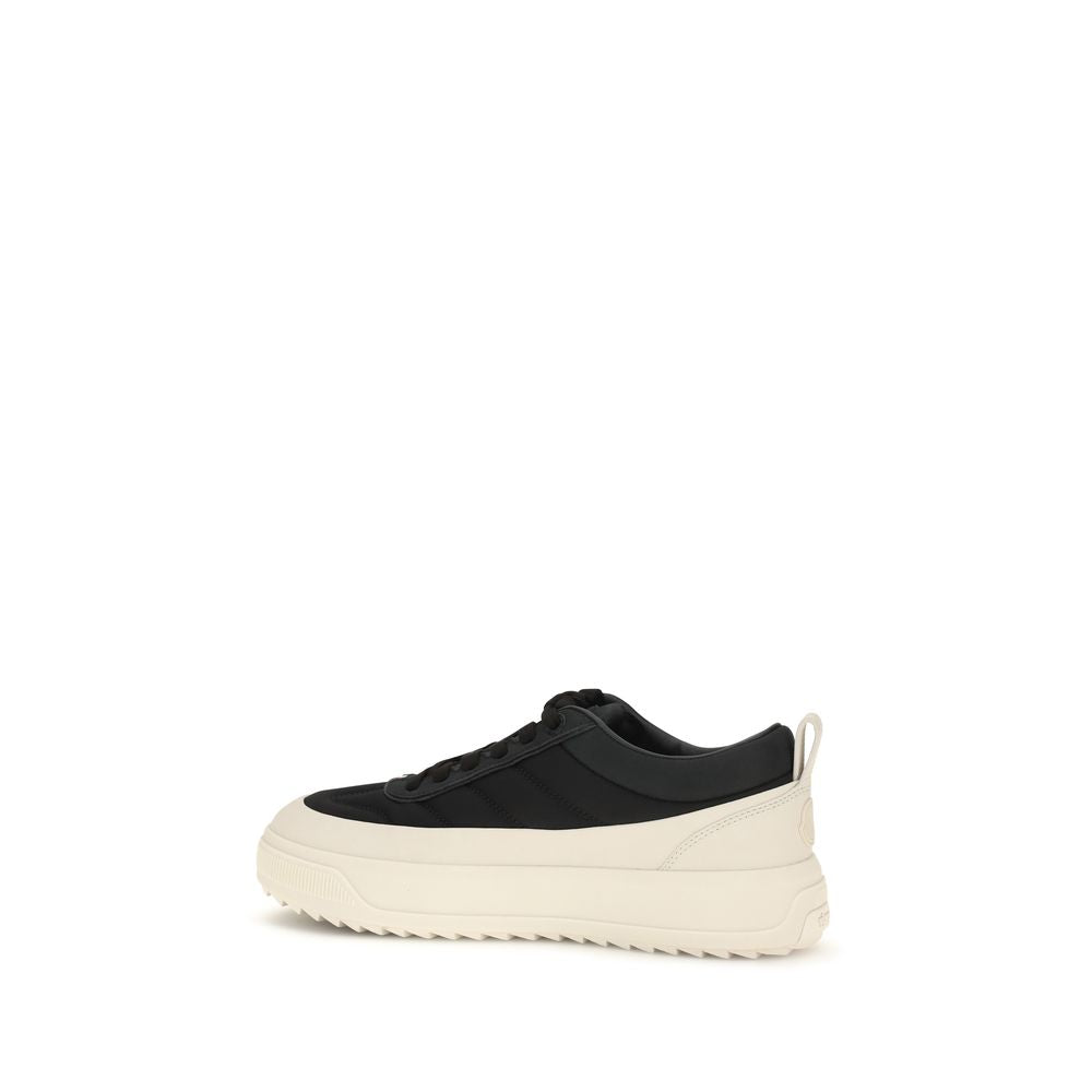 Black Moncler Bos Taurus athletic sneakers made of calf leather, featuring a sleek design and sporty style.