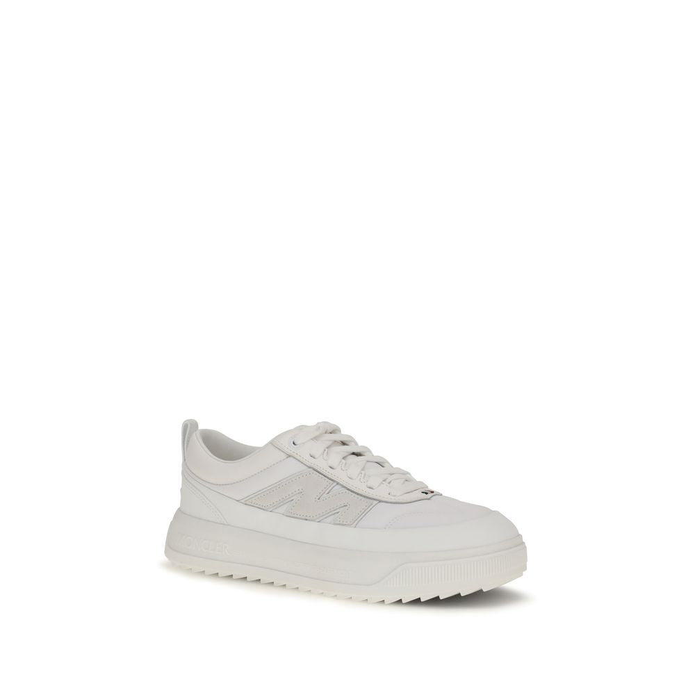 White Moncler Bos Taurus athletic sneakers made of calf leather, featuring a sleek design and sporty style.