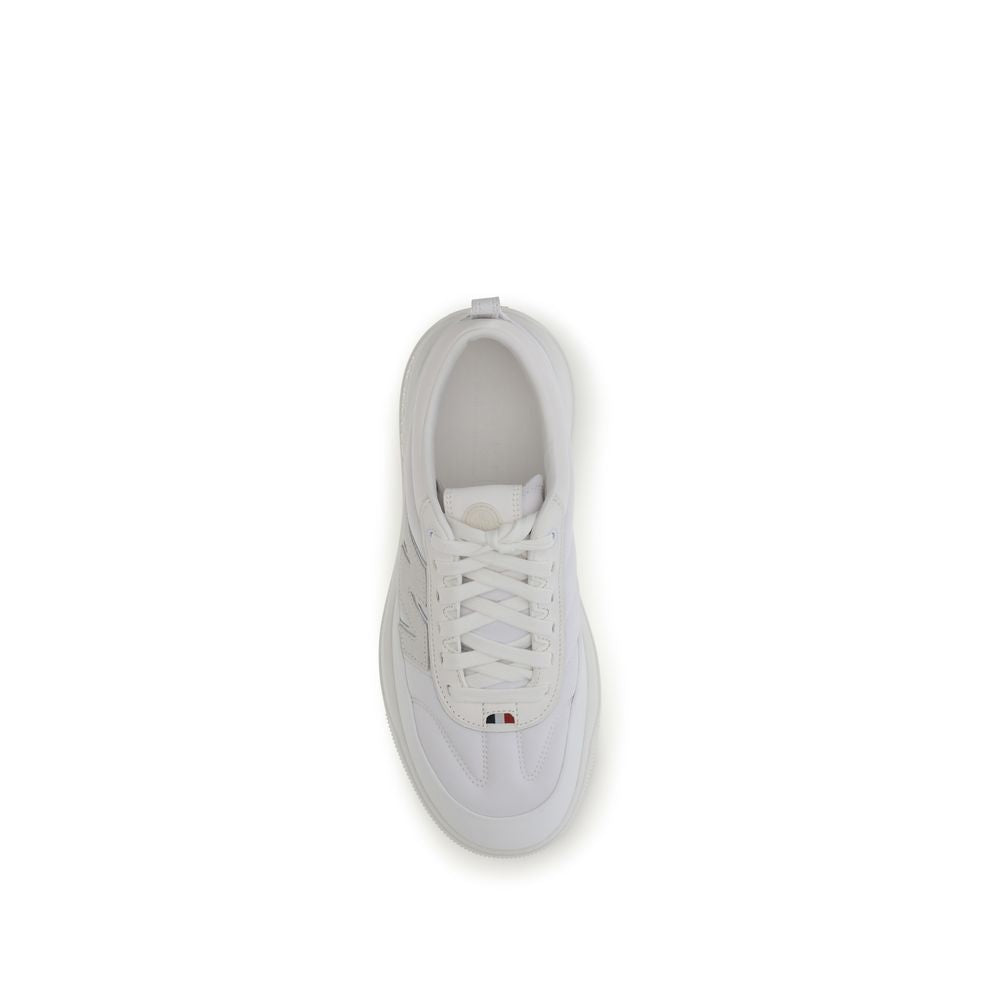 White calf leather Moncler Bos Taurus athletic sneakers with logo accents and sporty design.