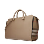 Burberry beige leather handbag with classic design and gold-tone hardware, featuring adjustable shoulder strap and logo detail.