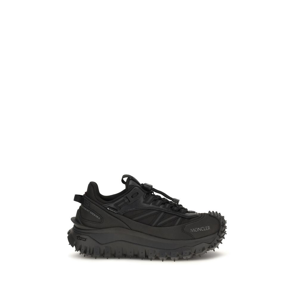 Moncler Black Calf Leather Bos Taurus athletic sneakers with sleek design and athletic silhouette.