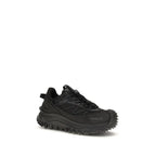 Black calf leather Moncler Bos Taurus athletic sneakers with sleek design and sporty laces on a clean background.