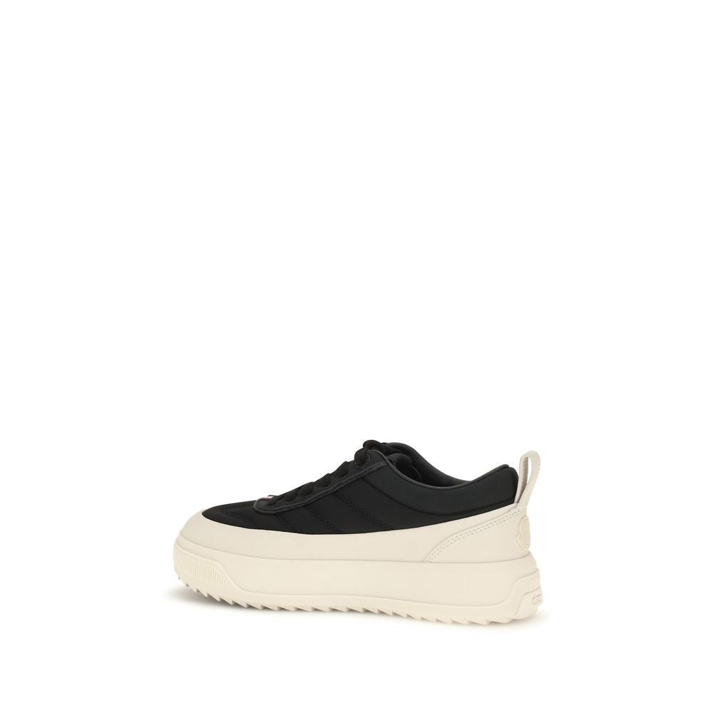 Black Moncler athletic sneakers made of durable polyamide with stylish design and sporty laces.