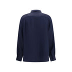 Max Mara blue silk shirt displayed on a hanger, featuring a classic collar and smooth, luxurious fabric.