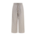 Off-White beige cotton casual pants displayed, featuring relaxed fit and minimalist design for everyday wear.