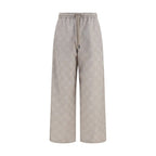 Off-White beige cotton casual pants displayed, featuring relaxed fit and minimalist design for everyday wear.