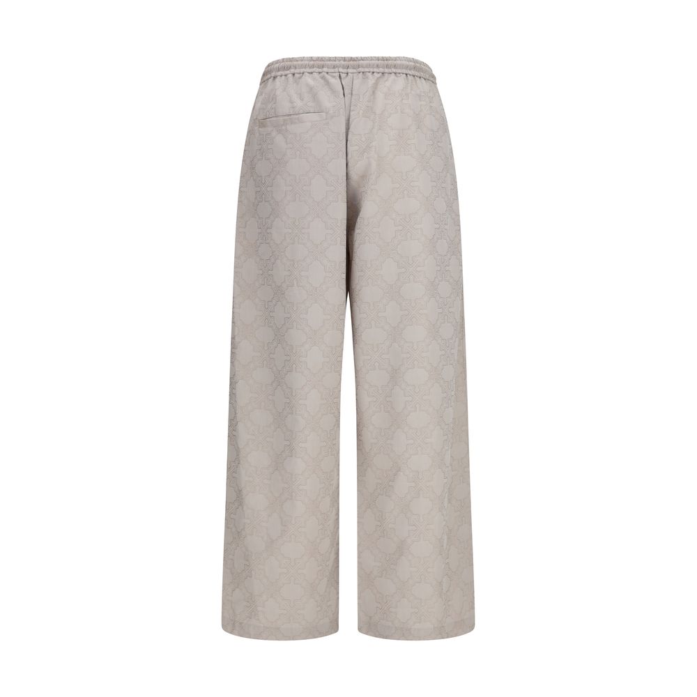 Beige Off-White cotton casual pants with relaxed fit and signature branding, displayed on a hanger.