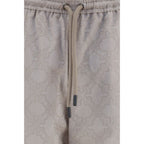 Off-White beige cotton casual pants with a relaxed fit, featuring a drawstring waist and minimalist design.