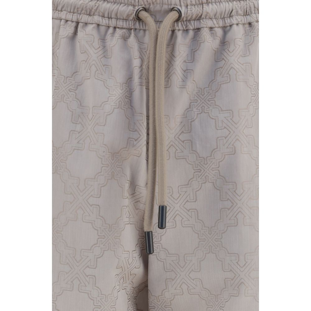 Off-White beige cotton casual pants with a relaxed fit, featuring a drawstring waist and minimalist design.