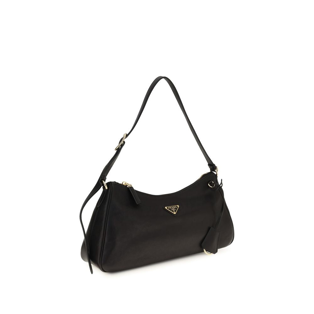 Prada black calf leather Bos Taurus shoulder bag with silver hardware and structured design.