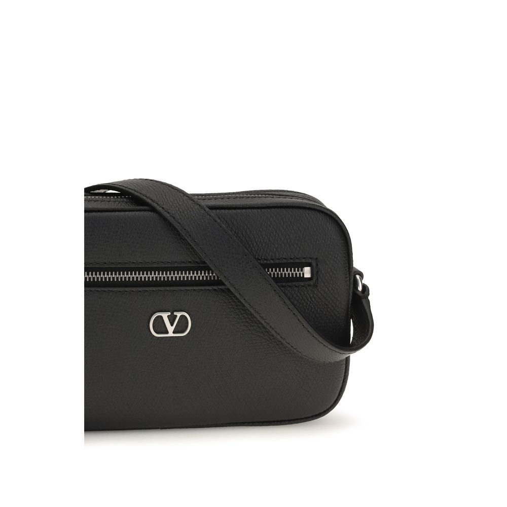 Valentino Garavani black calf leather Bos Taurus shoulder bag with gold-tone hardware and structured design.