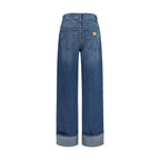 Dolce & Gabbana blue cotton straight-leg jeans displayed on a clothing rack with visible stitching and classic five-pocket design.