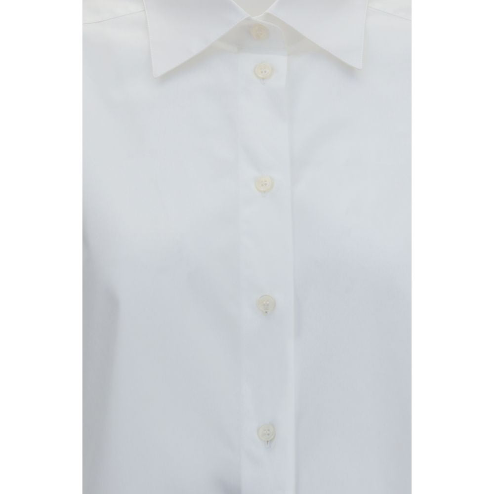 White cotton dress shirt by Dolce & Gabbana, featuring a classic fit with button-down collar and long sleeves, shown on a hanger.
