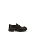 Prada brown calf leather Bos Taurus slip-on loafers with sleek design and classic styling, perfect for casual and formal wear.