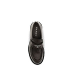 Prada brown calf leather Bos Taurus slip-on loafers with sleek design and classic style, perfect for casual or formal wear.