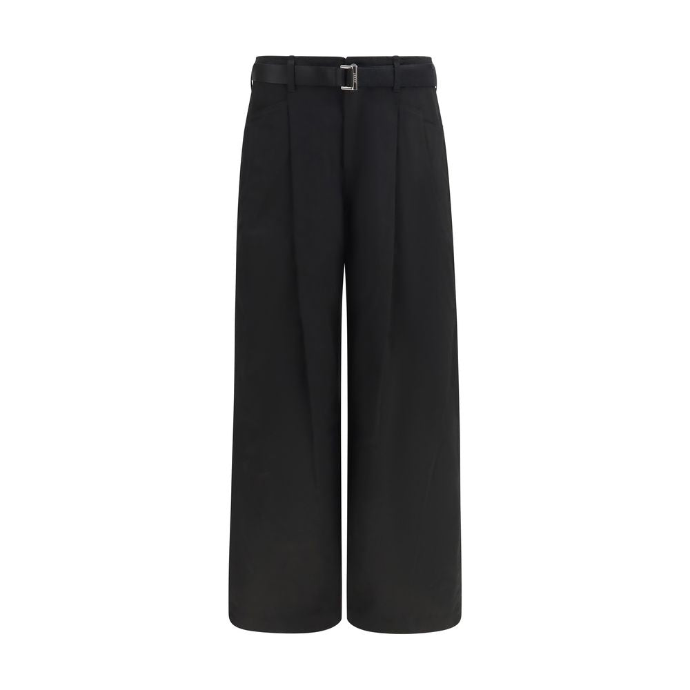 Sacai black cotton chino pants with a slim fit, featuring classic five-pocket design and belt loops.