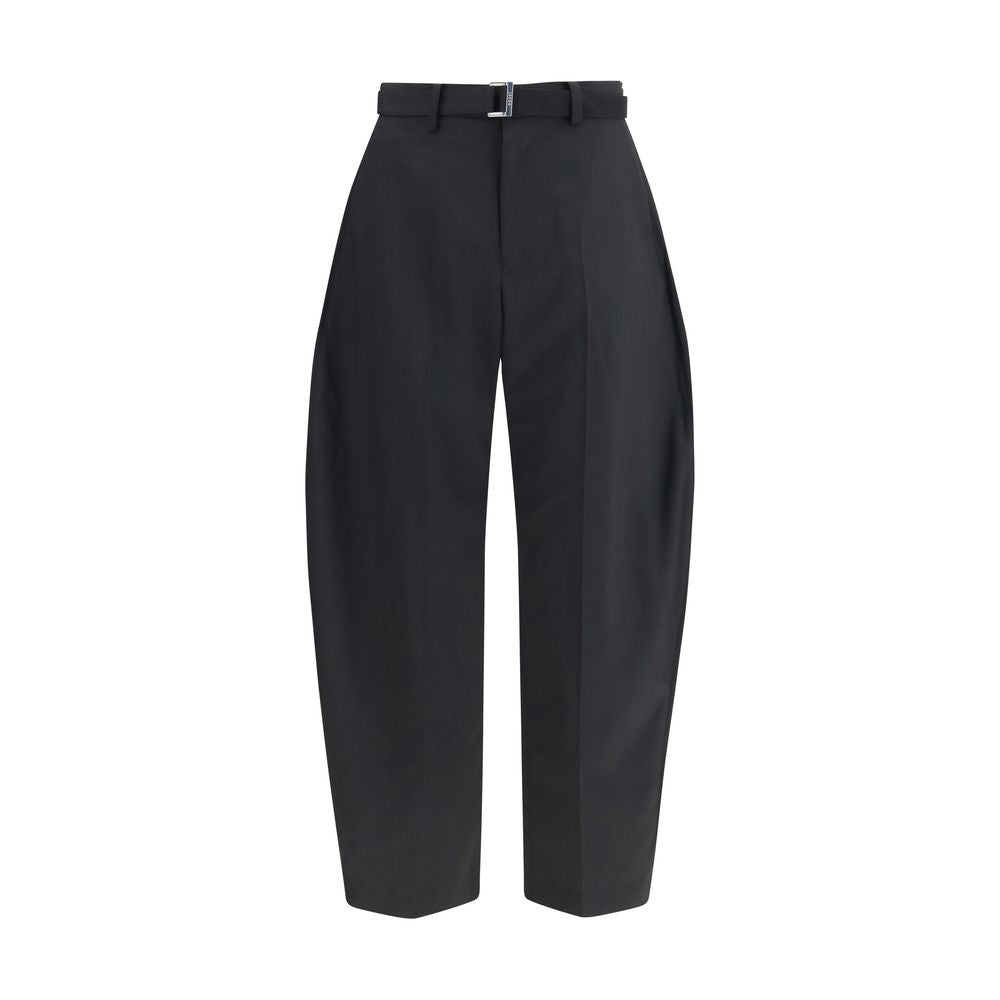 Sacai black polyester casual pants with a relaxed fit and minimalist design, shown on a neutral background.