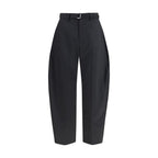 Sacai black polyester casual pants with a relaxed fit and minimalist design, shown on a neutral background.