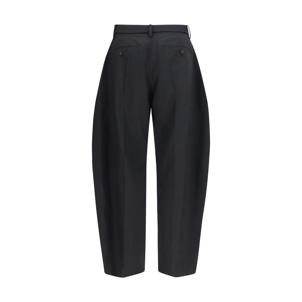 Sacai black polyester casual pants with a relaxed fit, featuring a comfortable waistband and modern design.