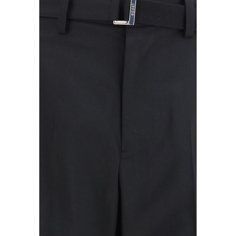 Sacai black polyester casual pants with a relaxed fit, featuring a sleek design and comfortable waistband.