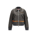Sacai bicolor nylon bomber jacket with front zipper and ribbed cuffs, featuring contrasting color panels and a sleek, modern design.
