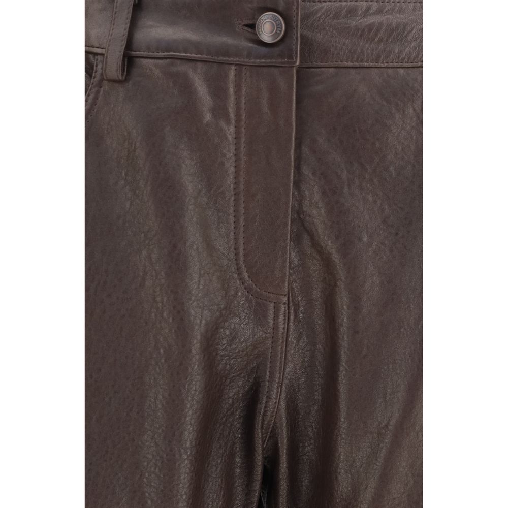 Magda Butrym brown leather pants with a high waist and sleek fit, displayed on a model against a neutral background.