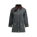 Barbour Bicolor cotton coat displayed hanging, featuring a classic design with contrasting color blocks and a detachable hood.